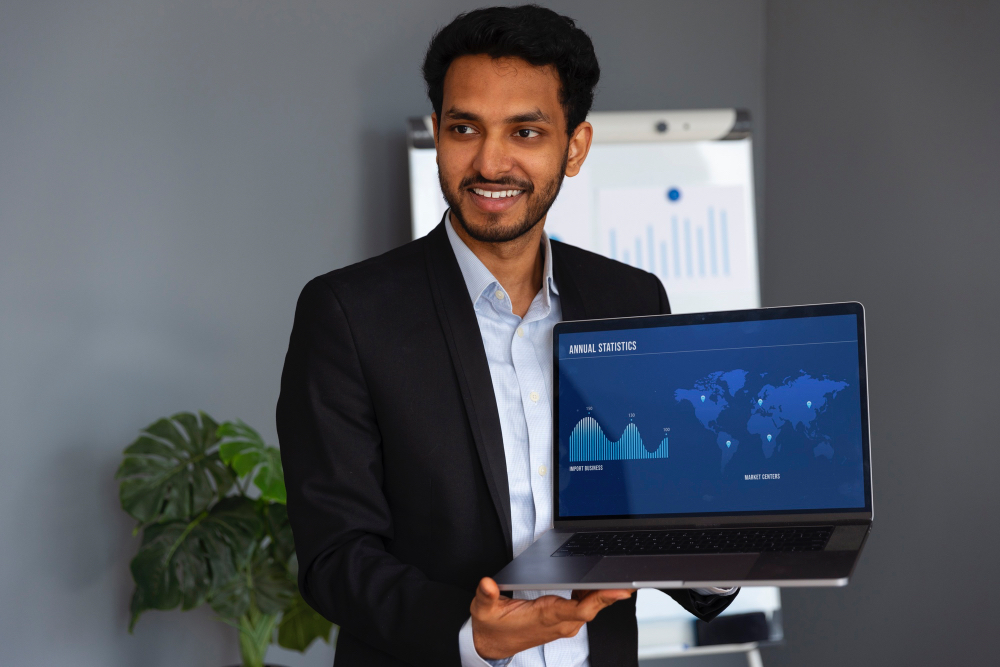 Scaling operations with SAP Business One — reviewing growth statistics on a laptop dashboard